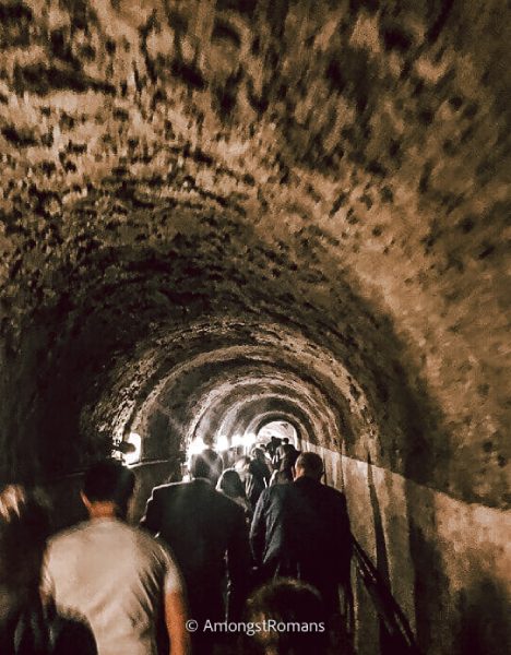 people walking in a tunnel