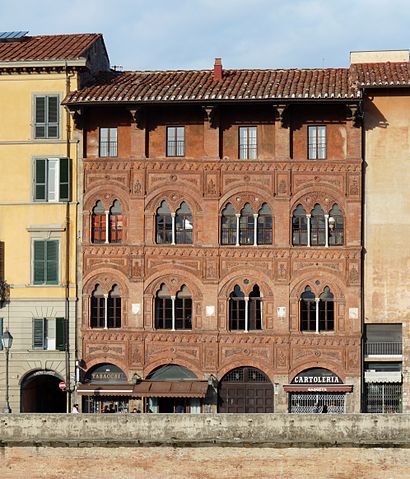 Redbrick exterior of the Palazzo Agostini in Pisa