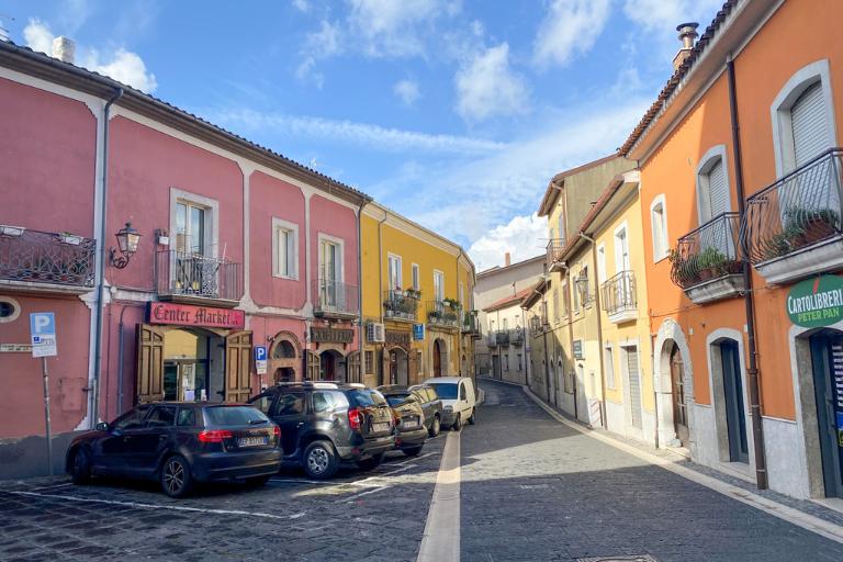a narrow road in a small town in italy