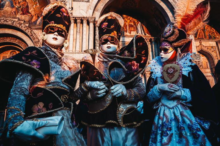 masked people in venice during the carnaval 