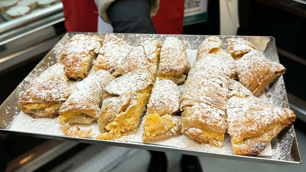 naples food tour a tray of pastries with powdered sugar