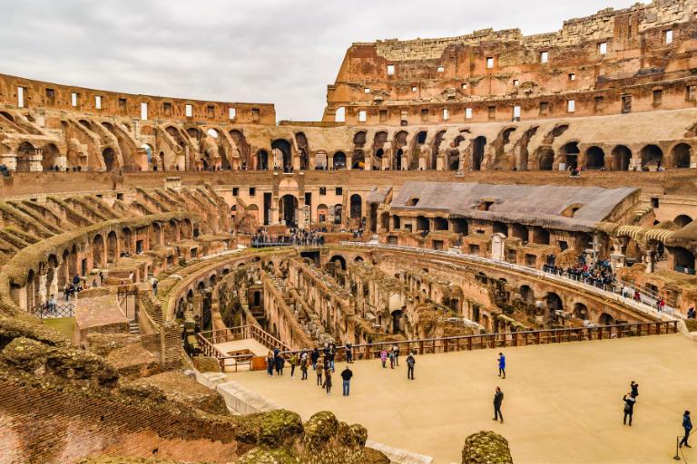 a group of people in the Colosseum in rome